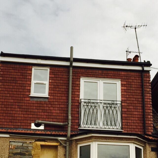 Rear loft dormer with Juliet balcony on a brick terrace