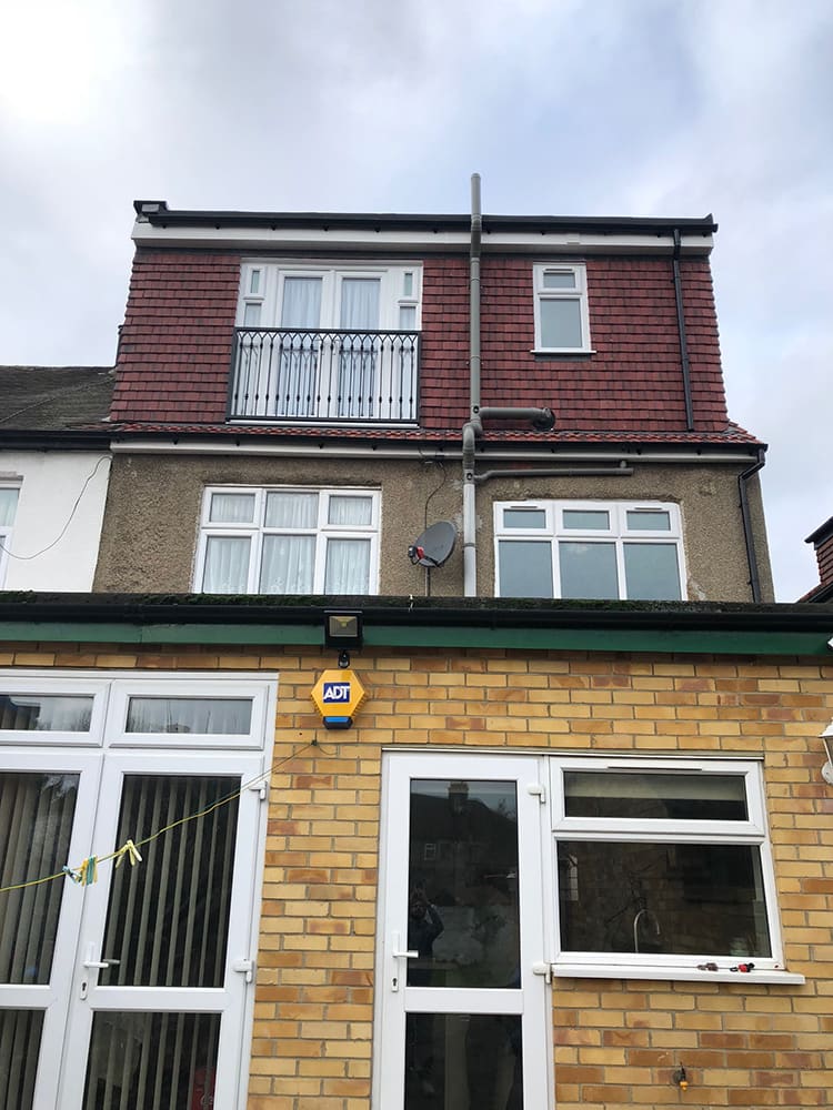 Yellow brick rear elevation with new windows