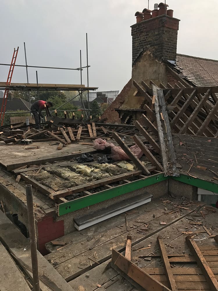 Roof structure opened up with old timbers exposed