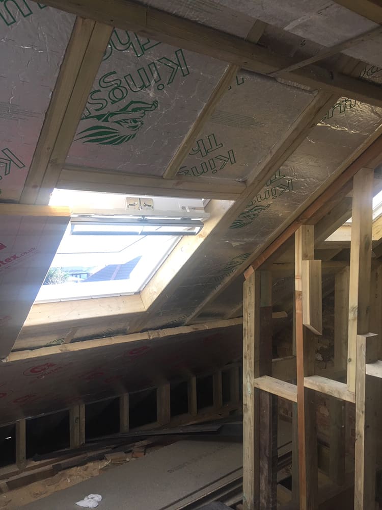 Loft stud walls framed with a Velux rooflight fitted