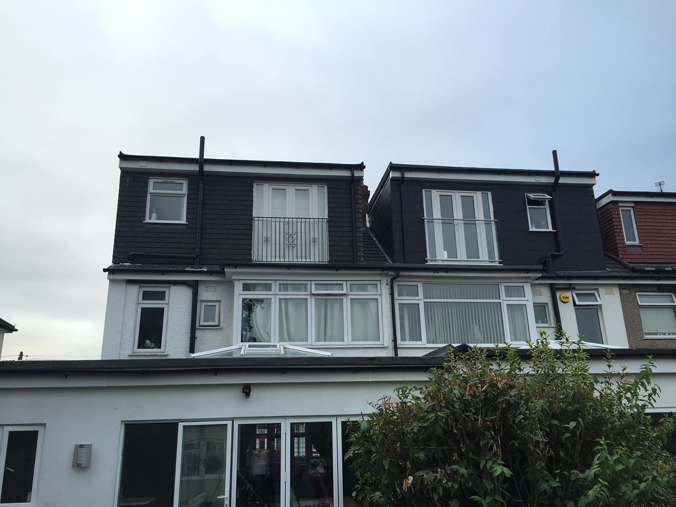 Rear elevations of a London terrace with loft dormers