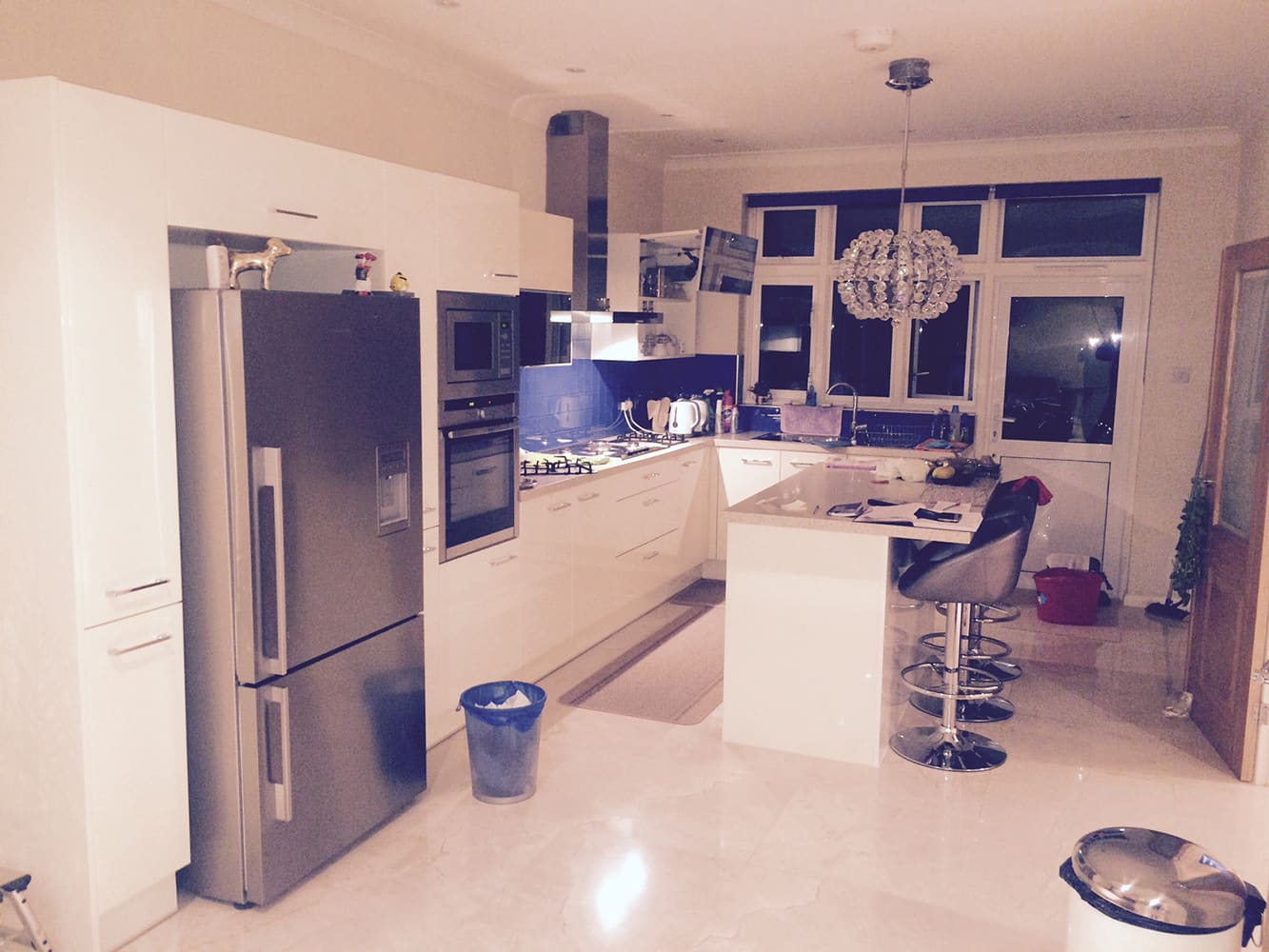 Refurbished open-plan kitchen with breakfast bar and appliances