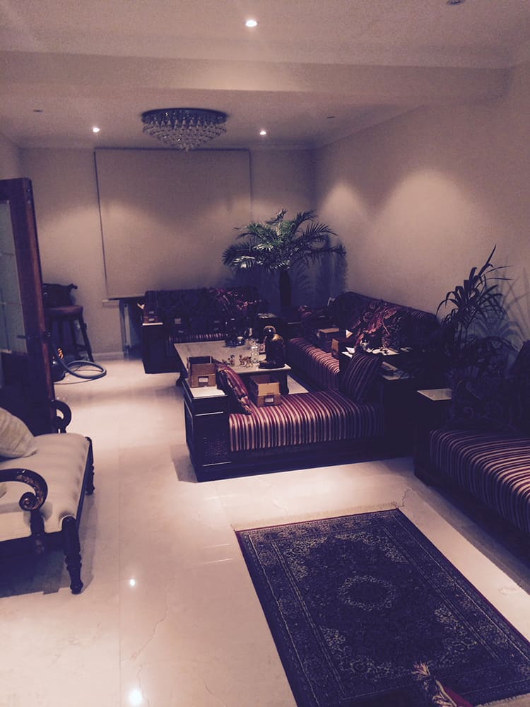 Refurbished lounge with striped sofas and finished decoration