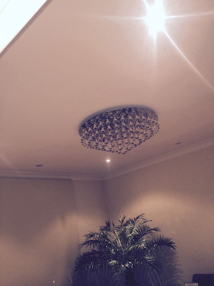 Crystal ceiling light on the finished plaster ceiling