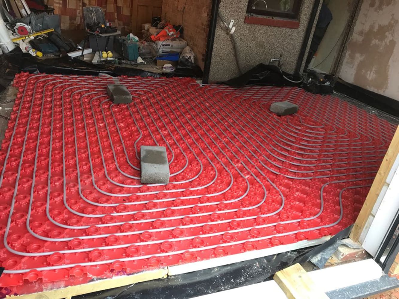 Underfloor heating circuits laid across a commercial floor
