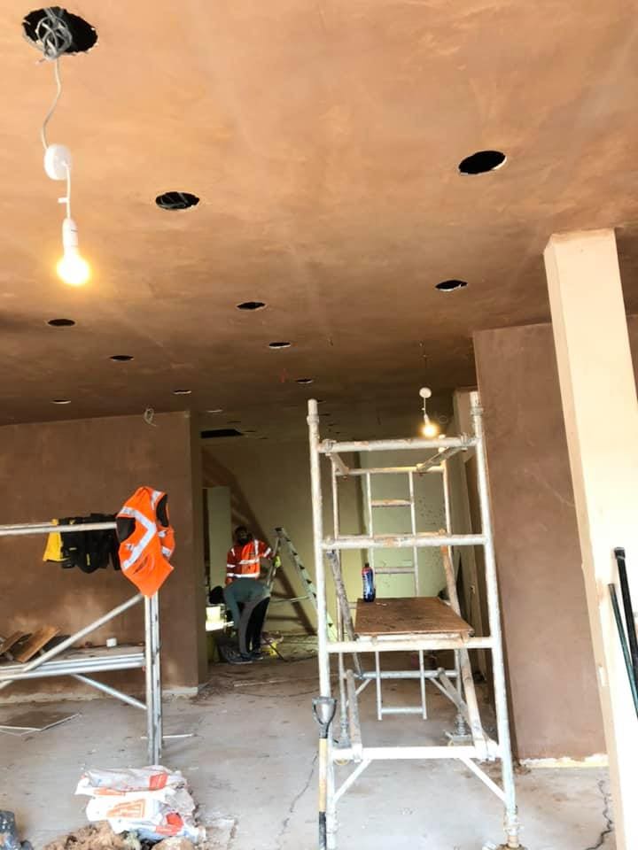 Operatives working in the stripped retail unit