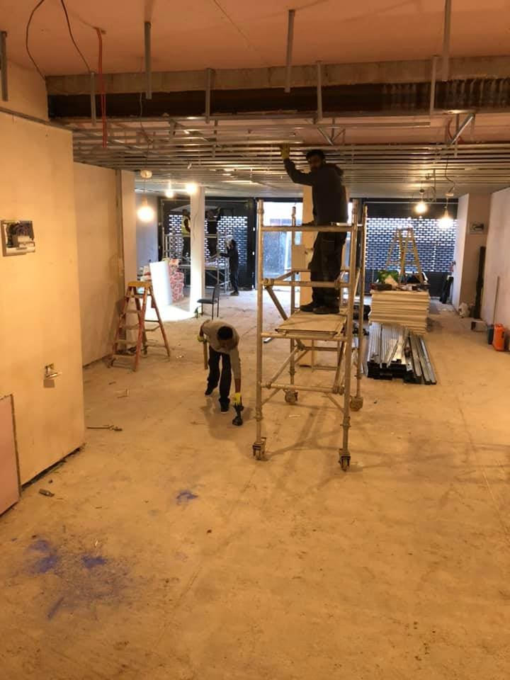 Scaffold tower and partition framing inside the retail unit