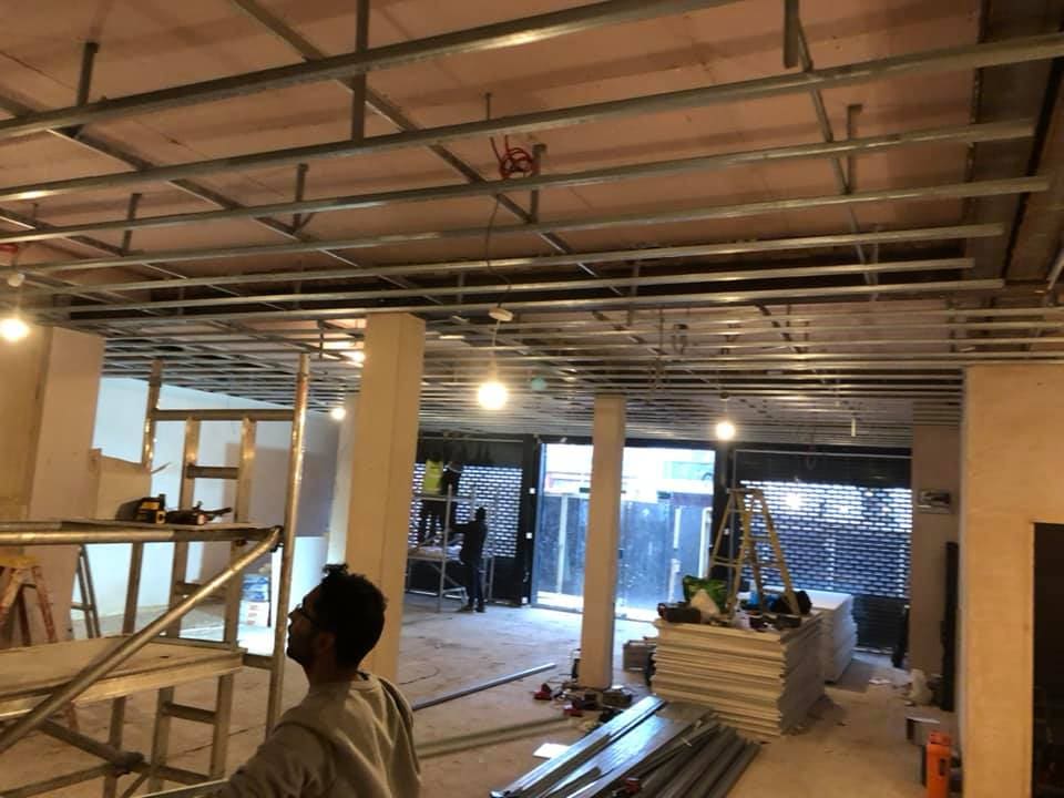 Suspended ceiling framing and services above the shop floor