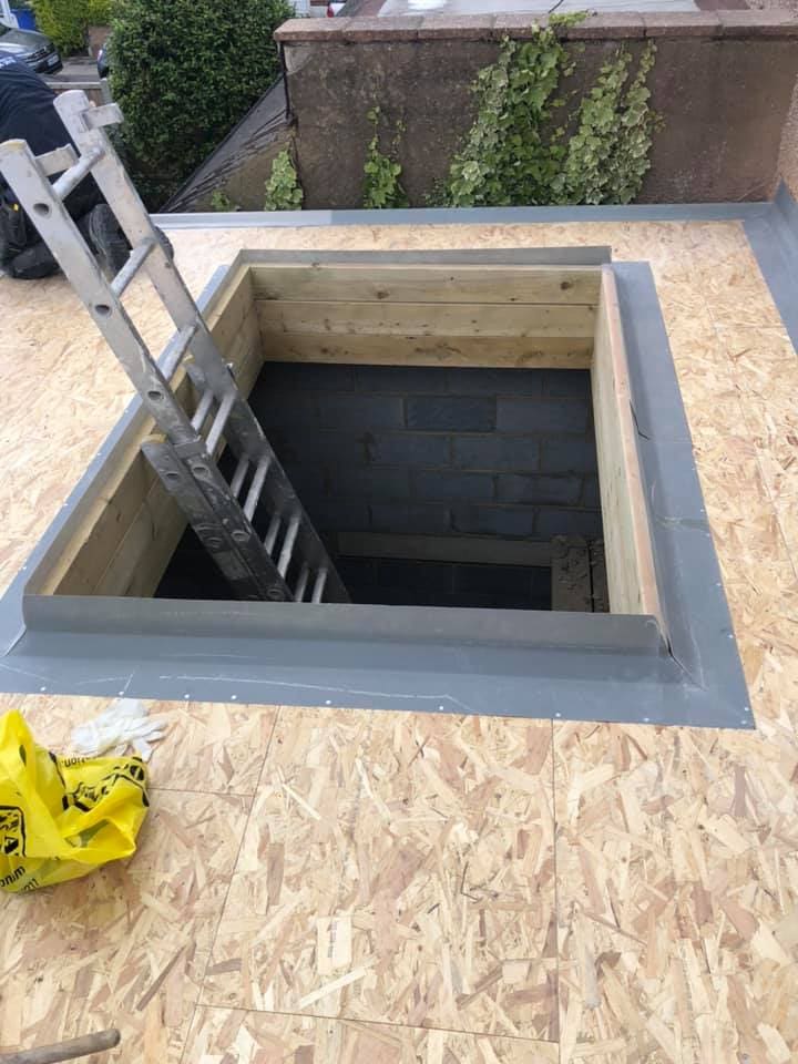 Rooflight upstand opening framed in the new flat roof deck