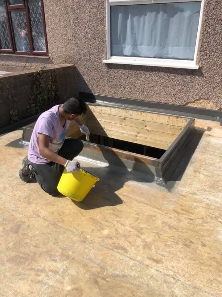 Operative laminating the GRP upstand for a roof lantern