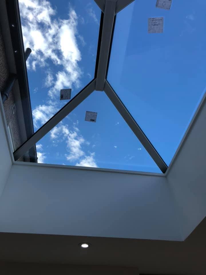 Roof lantern glazing against a blue sky