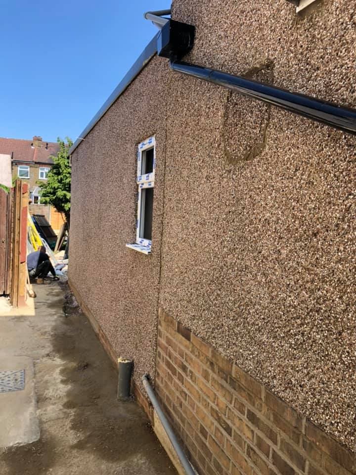 New pebbledash render on the extension flank wall