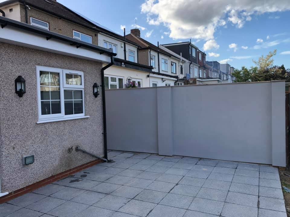 Finished extension with patio, lamps and rendered walls