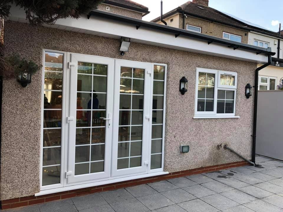 Finished extension with French doors and exterior lighting