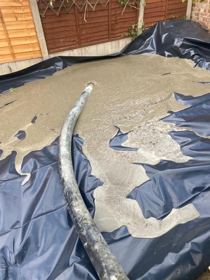 Concrete being pumped over the membrane for the ground floor slab
