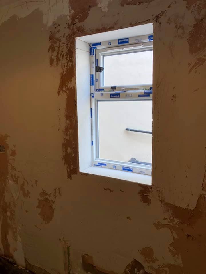 Bare plaster and new window during the kitchen refit