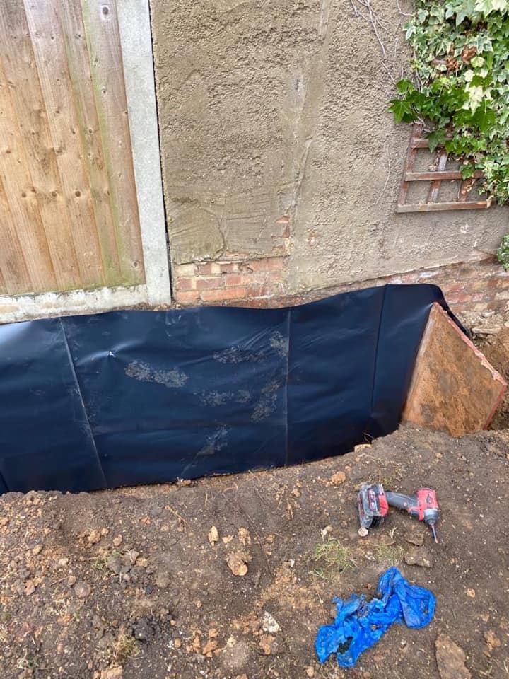 Damp-proof membrane dressed up the walls before the slab pour
