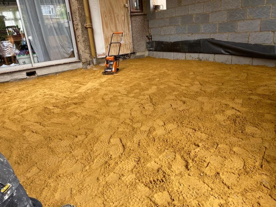 Sand and cement screed laid over insulation before the final floor finish